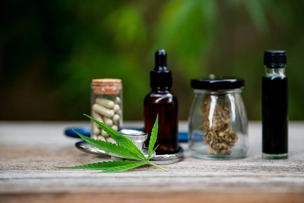 Medical cannabis flower, capsules and tincture bottles on a table